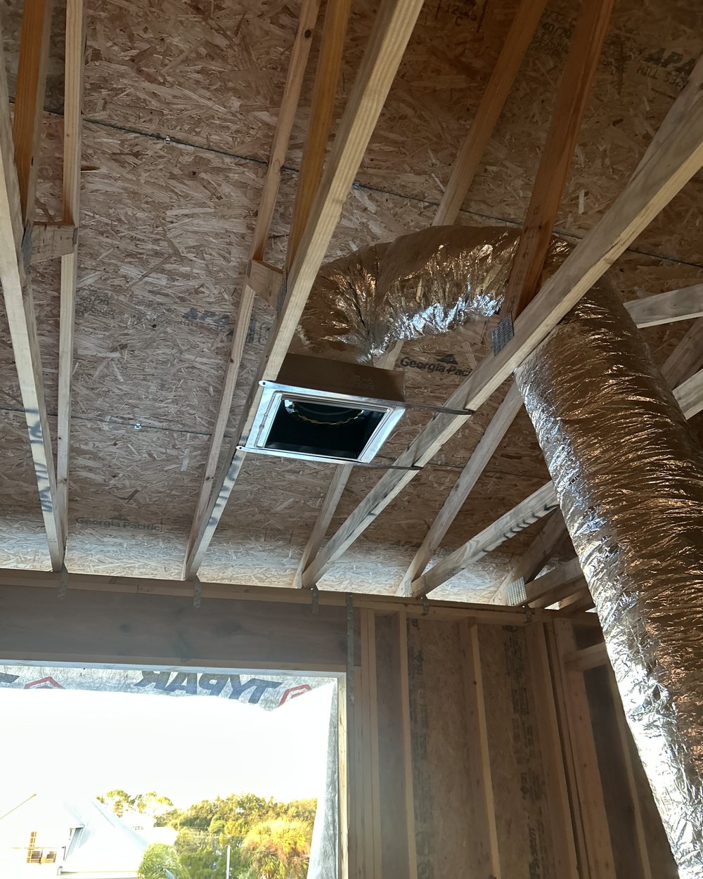 New insulated flex duct run to a ceiling boot in an attic